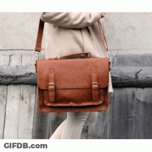 Woman In Tan Coat With Brown Leather Messenger Bag GIF