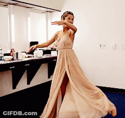 Woman In Tan Dress Dancing GIF