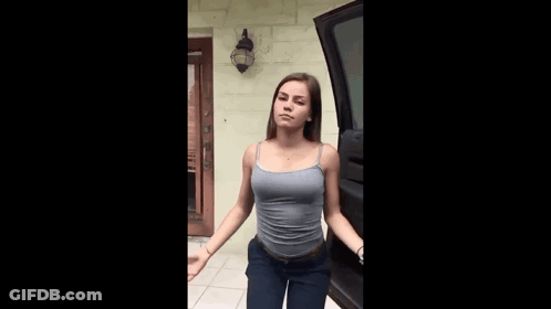 Woman In Tank Top And Jeans GIF
