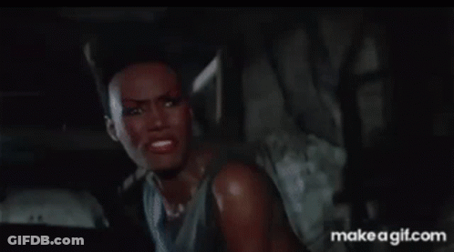 Woman In Tank Top Making Funny Face GIF