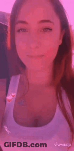 Woman In Tank Top Next To Man In Black Shirt GIF