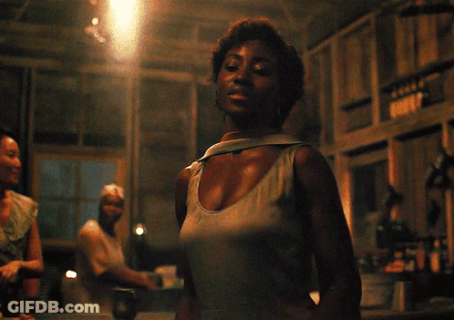 Woman In Tank Top Standing Near Ruby Sign GIF