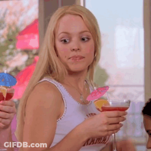 Woman In Tank Top With Kama Holding Martini GIF