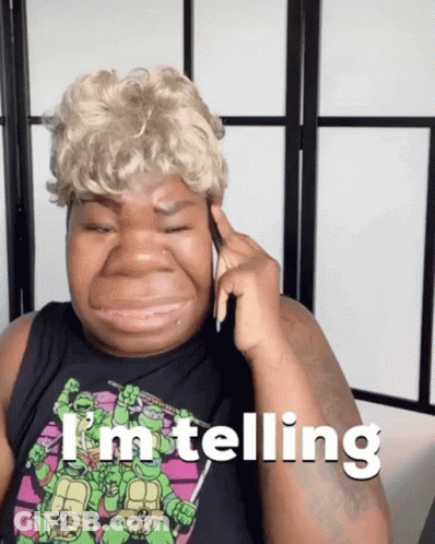 Woman In Teenage Mutant Ninja Turtles Shirt Talking On Phone GIF