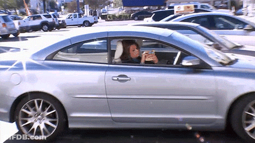 Woman In The Car Eating Sour Patch Kids Candy GIF