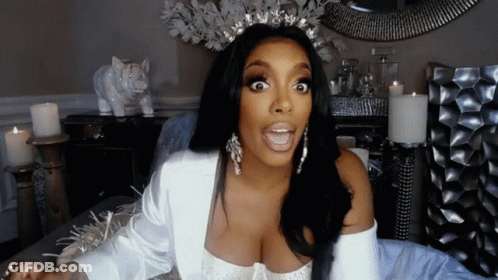 Woman In Tiara And Earrings Making Funny Face GIF