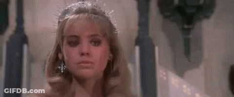 Woman In Tiara And Earrings Sitting On Throne GIF
