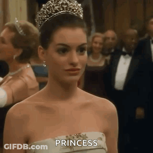 Woman In Tiara And Strapless Dress GIF