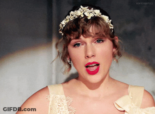 Woman In Tiara And White Dress With Red Lipstick GIF