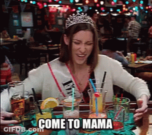 Woman In Tiara At Table With Drinks Saying Come To Mama GIF