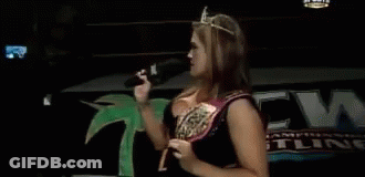 Woman In Tiara Holding Microphone And Pointing GIF