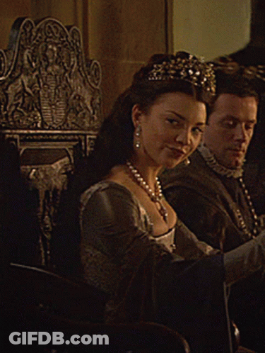 Woman In Tiara Sits Next To Man GIF