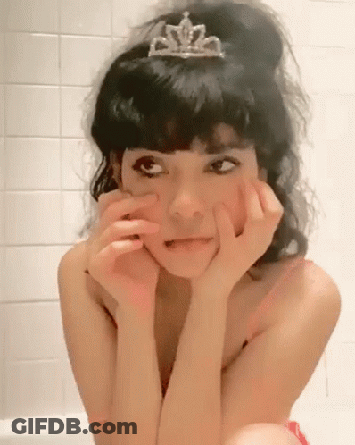 Woman In Tiara Sitting In Bathtub Making Funny Face GIF