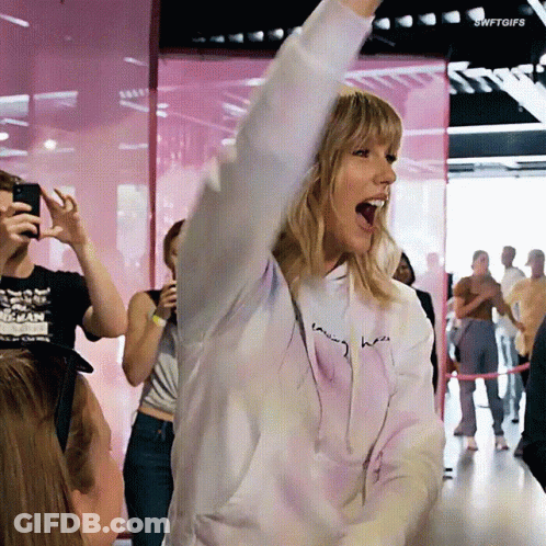 Woman In Tie Dye Hoodie Saying Taylor GIF