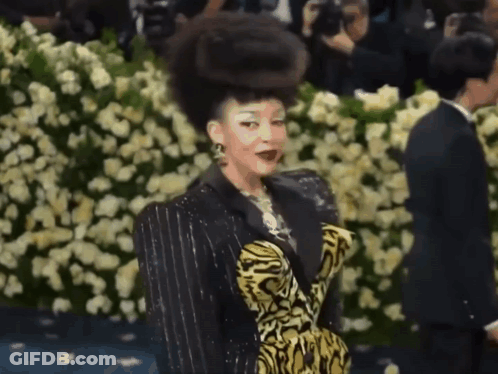 Woman In Tiger Print Dress GIF