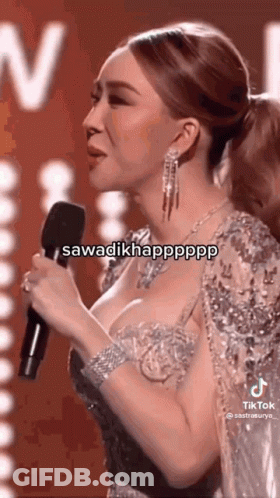 Woman In Tight Dress Singing Into Microphone GIF