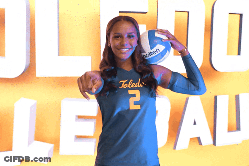 Woman In Toledo Jersey Holding Molten Volleyball GIF
