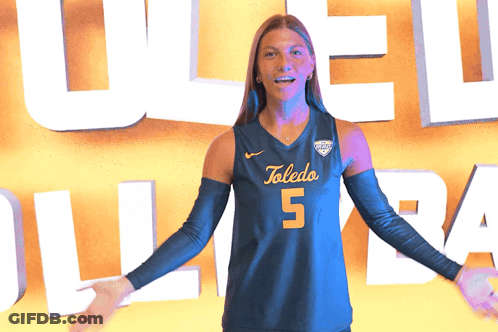 Woman In Toledo Jersey Holding Volleyball GIF