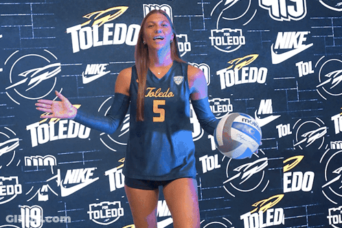 Woman In Toledo Jersey Holding Volleyball GIF