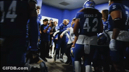 Woman In Toledo Jersey In Front Of Nike Logos GIF