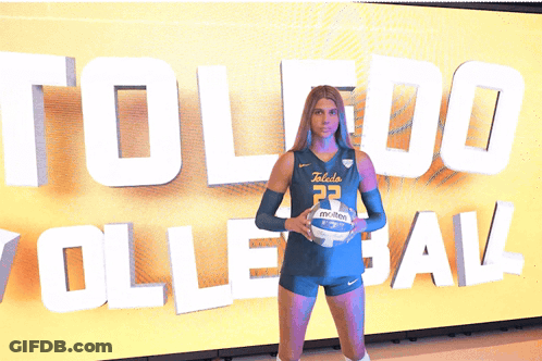 Woman In Toledo Volleyball Uniform Holding Volleyball GIF