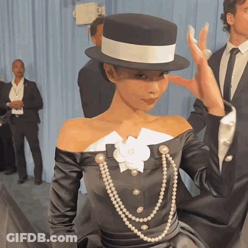Woman In Top Hat And Pearls GIF