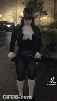 Woman In Top Hat And White Socks On Street GIF