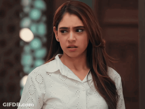 Woman In Torn White Shirt Looking To Side GIF