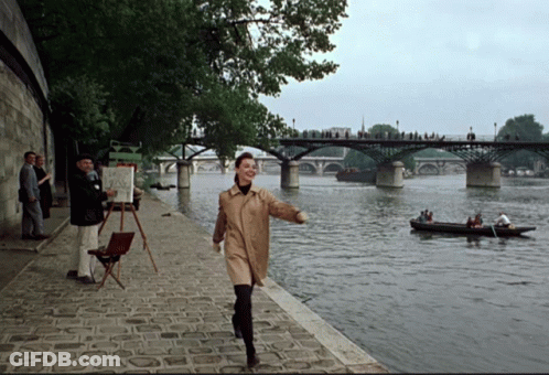 Woman In Trench Coat By River GIF
