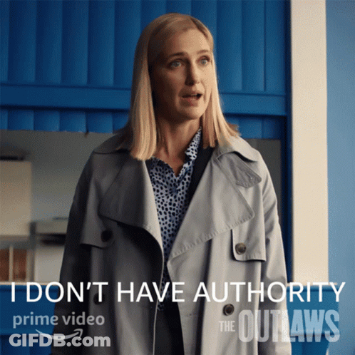 Woman In Trench Coat I Don't Have Authority GIF