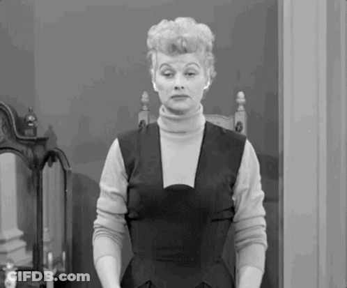 Woman In Turtleneck And Black Dress GIF
