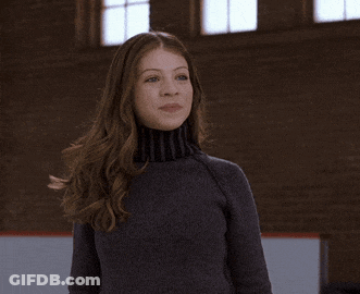 Woman In Turtleneck Clapping GIF
