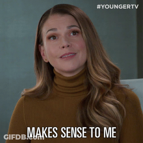Woman In Turtleneck Smiling Says Makes Sense To Me GIF