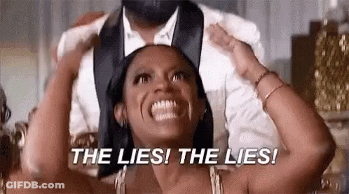 Woman In Tuxedo Holding Man's Head And Screaming GIF