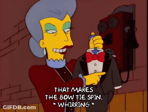 Woman In Tuxedo Says That Makes The Bow Tie Spin GIF