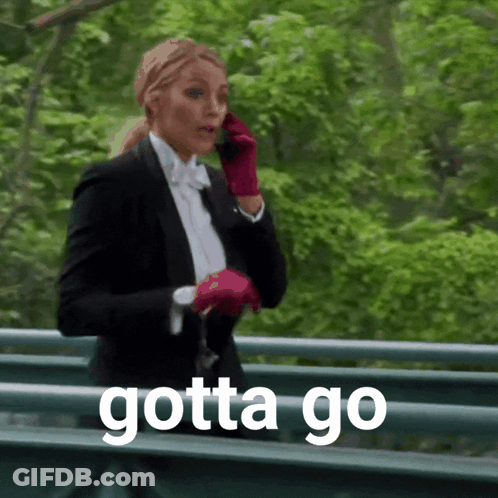 Woman In Tuxedo Talking On Cell Phone Saying Gotta Go GIF