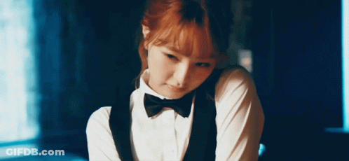 Woman In Tuxedo With Bow Tie GIF