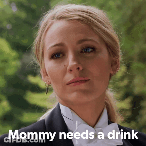 Woman In Tuxedo With Text Mommy Needs A Drink GIF