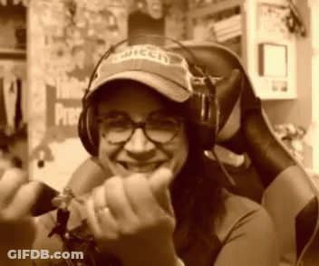 Woman In Twitch Hat And Headphones Smiling GIF
