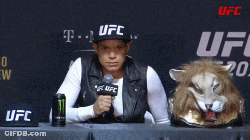 Woman In UFC Hat Sitting At Table GIF