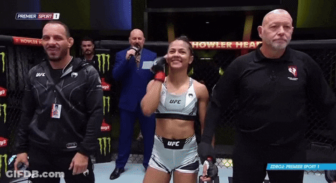Woman In UFC Outfit Standing In Ring GIF
