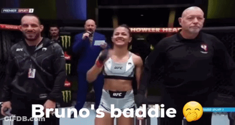 Woman In UFC Top Standing In Front Of Referee GIF