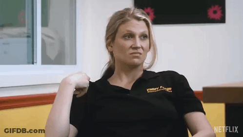 Woman In Valley Forge Shirt Sitting By Window GIF