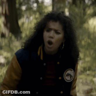 Woman In Varsity Jacket Making Funny Face GIF