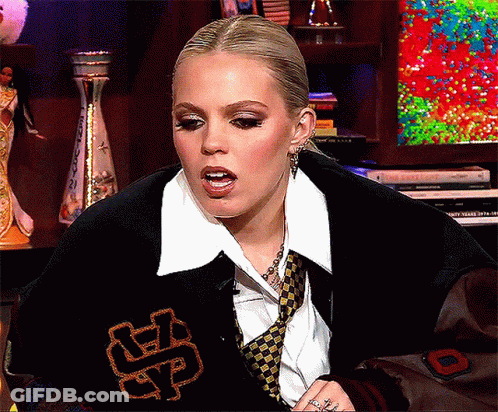 Woman In Varsity Jacket With Letter S GIF
