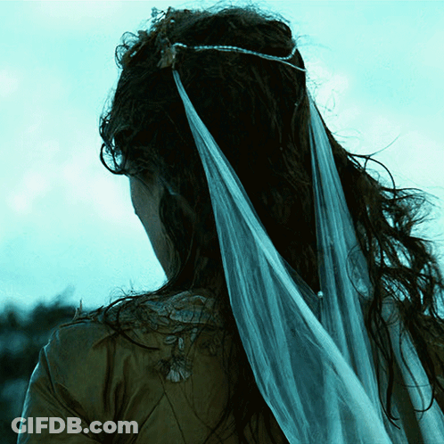 Woman In Veil And Crown Looking Down GIF