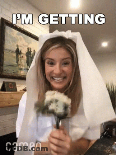 Woman In Veil Holding Bouquet GIF
