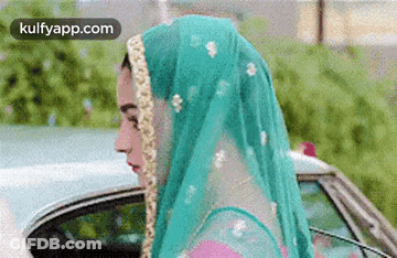 Woman In Veil Standing Next To Car GIF