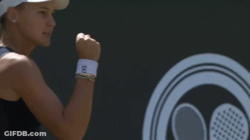 Woman In Visor Screaming With Fist In Air Tennis GIF