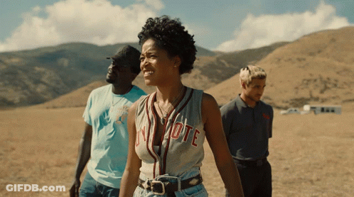 Woman In Vote Jersey In Field GIF